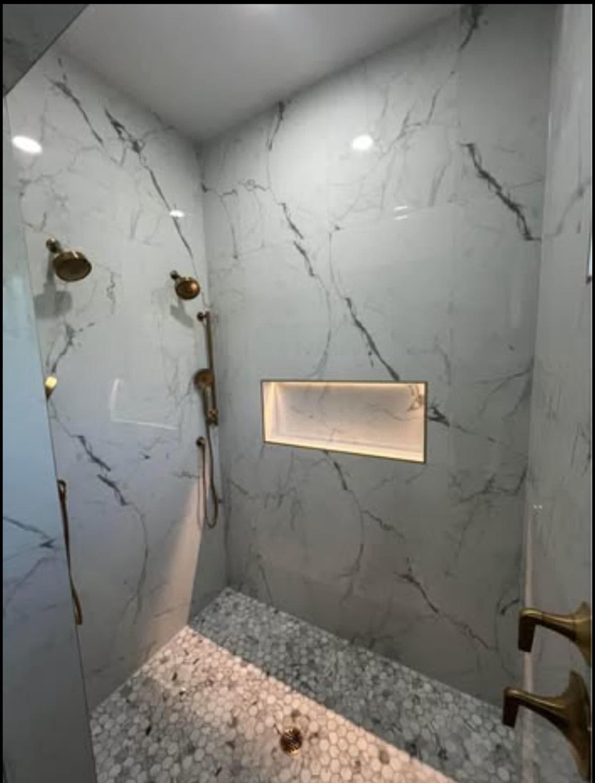Marble Shower with Gold Fixtures