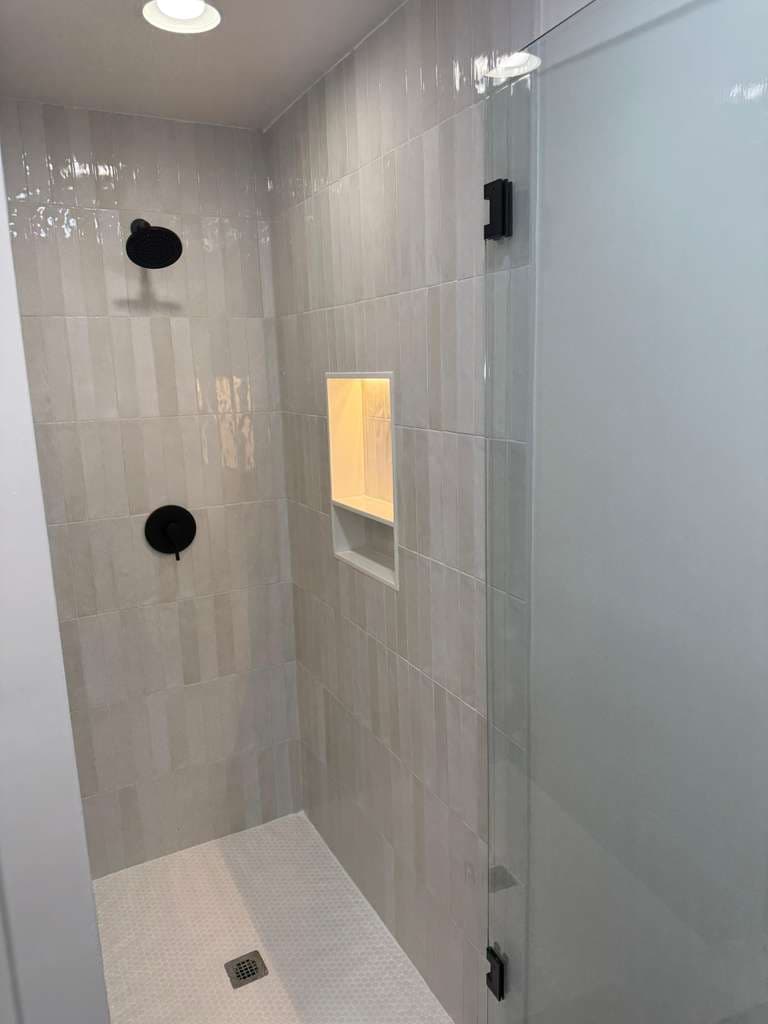 Vertical Tile Shower & Glass Door