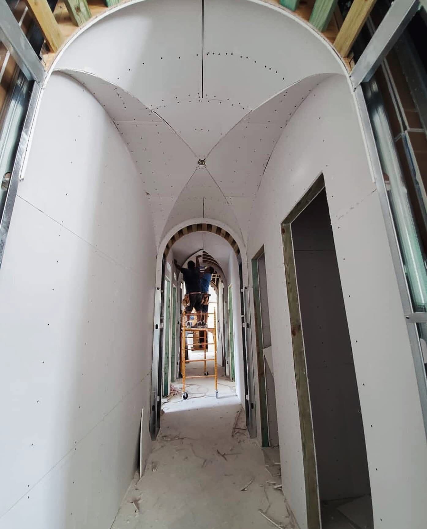 Arched Hallway with Vaulted Ceiling